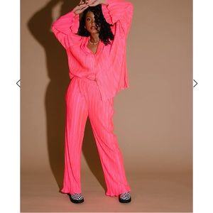 Dressed in Lala Plissé set in electric pink